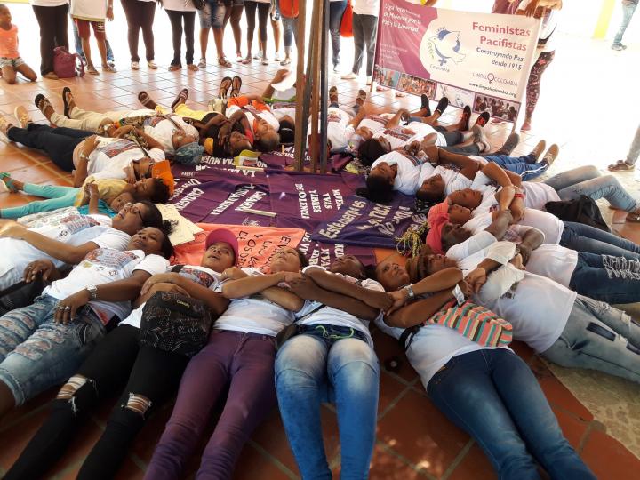 Women laying in a circle as a matter of activism and protest for women's rights