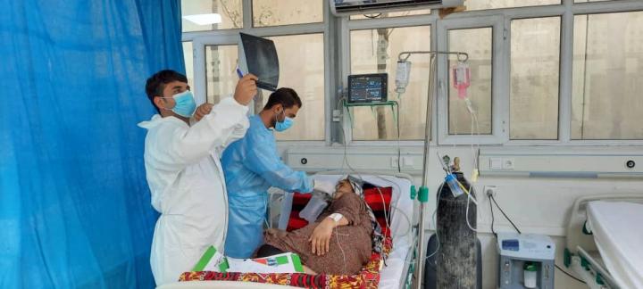 Doctors treat a patient with COVID-19 at the Afghan-Japan Hospital in Kabul