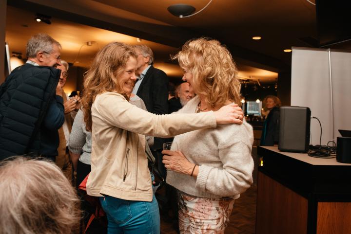 Women smiling at each other on the celebration party of HNTPO's 30th anniversary