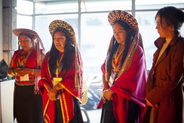 Colombian women standing in traditional indigenous clothing