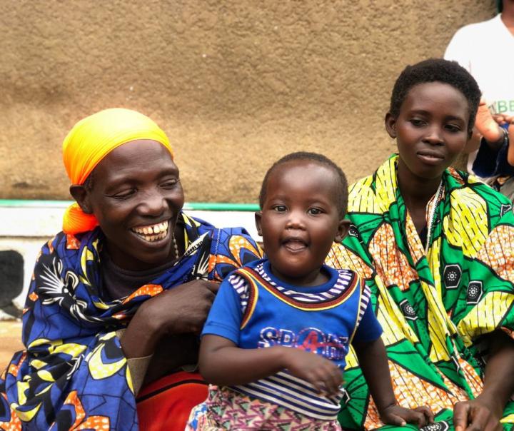 Niyonzima Goreth with her daughter and granddaughter smiling