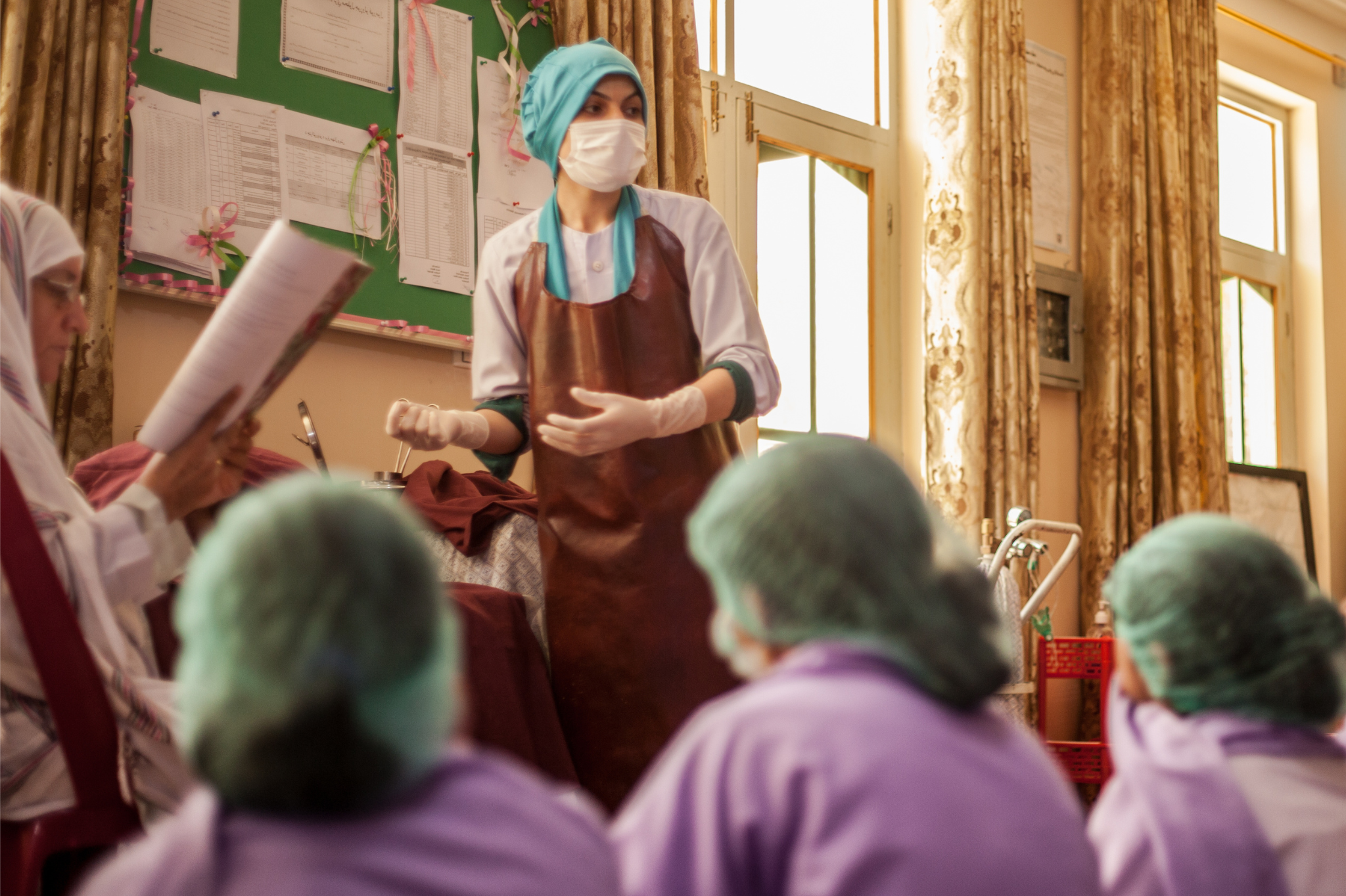 Afghan women in a classroom receiving medical training